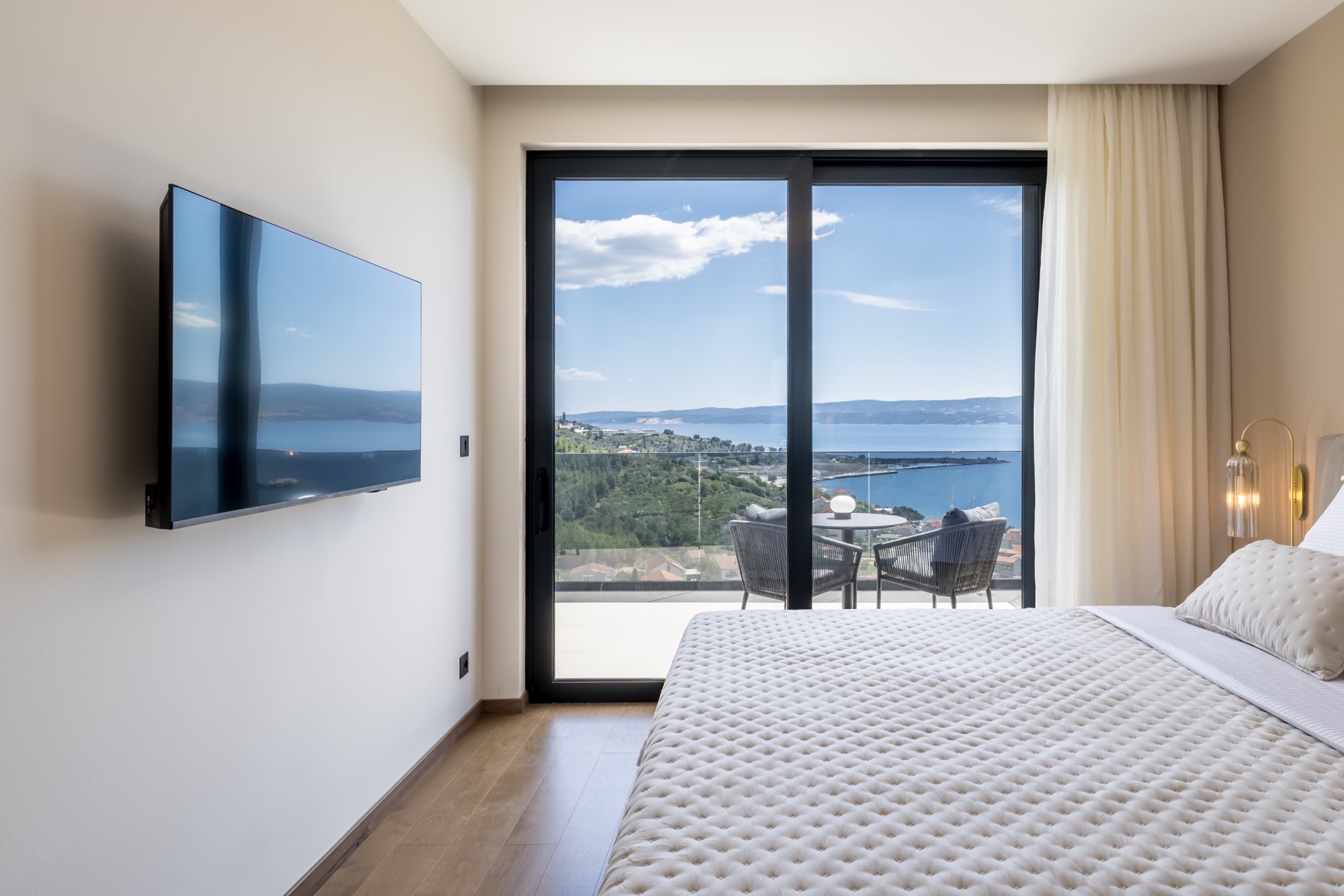 Bedroom opening to panoramic balcony