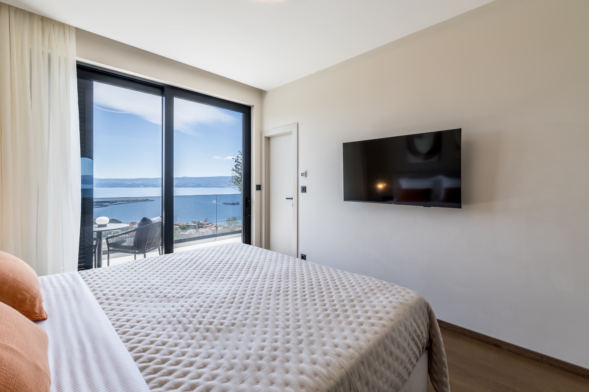 Bright bedroom with balcony access