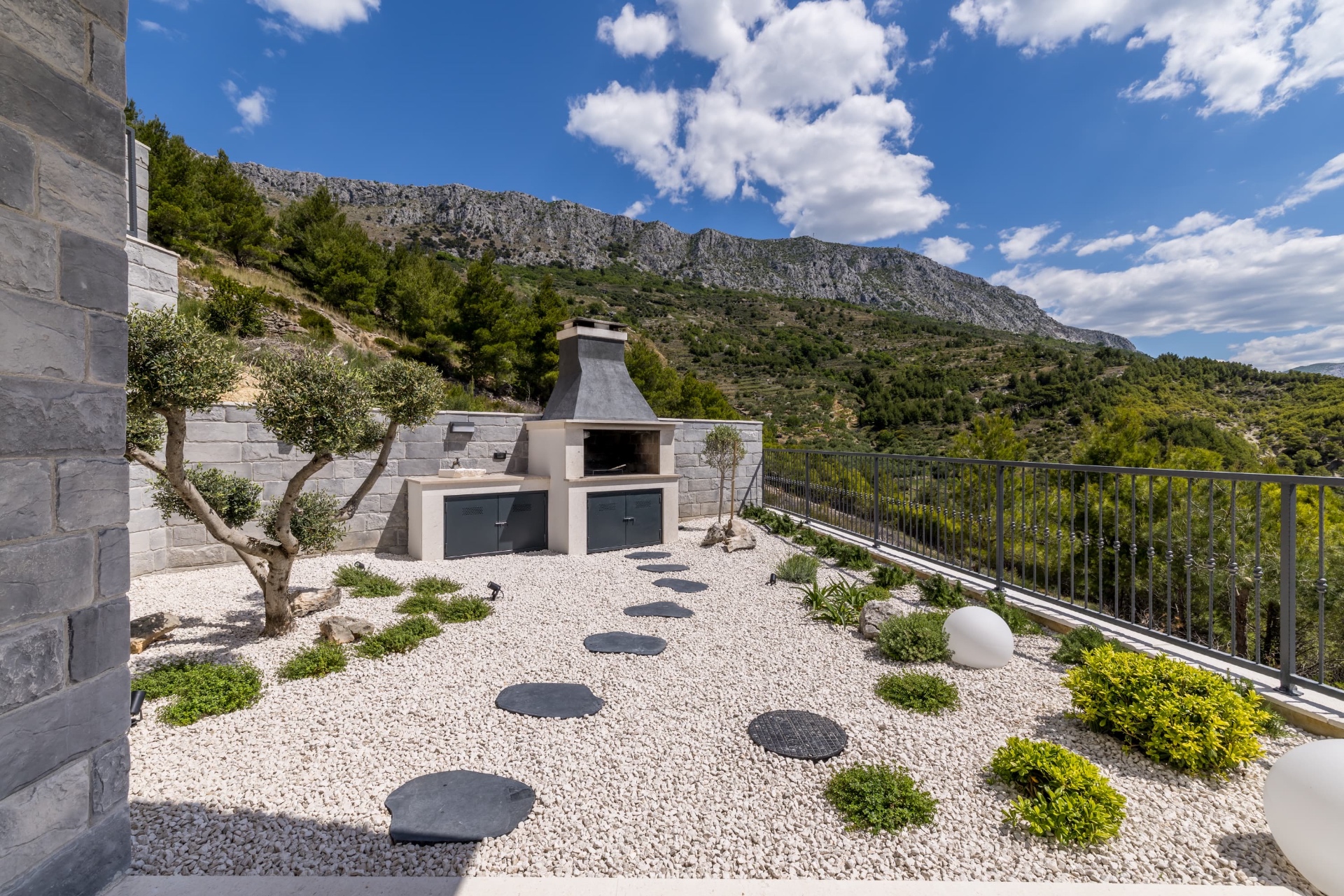 Outdoor BBQ area with mountain backdrop