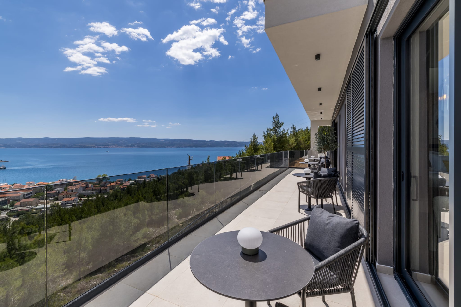 Sea-view balcony with lounge seating