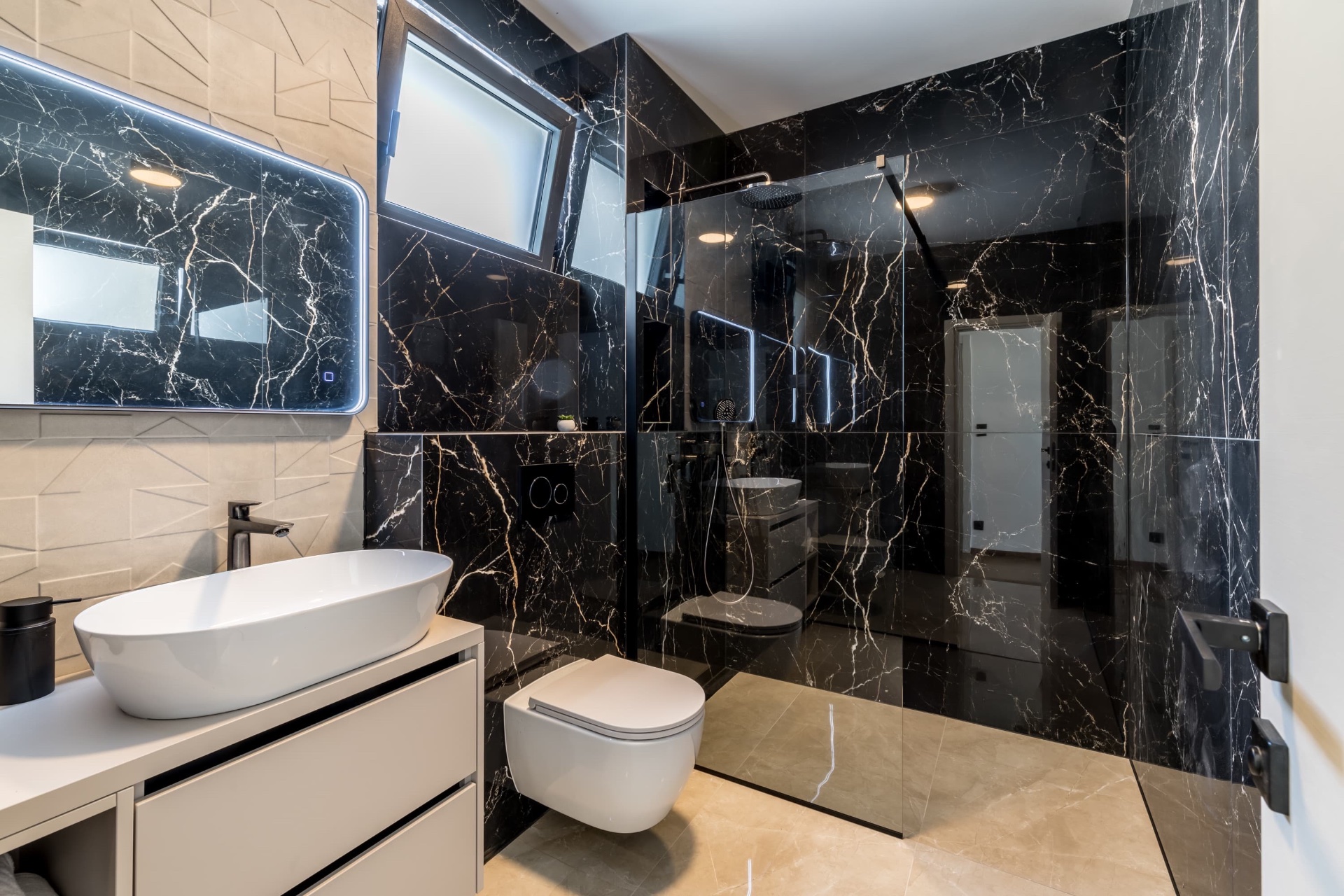 Black marble bathroom with rain shower