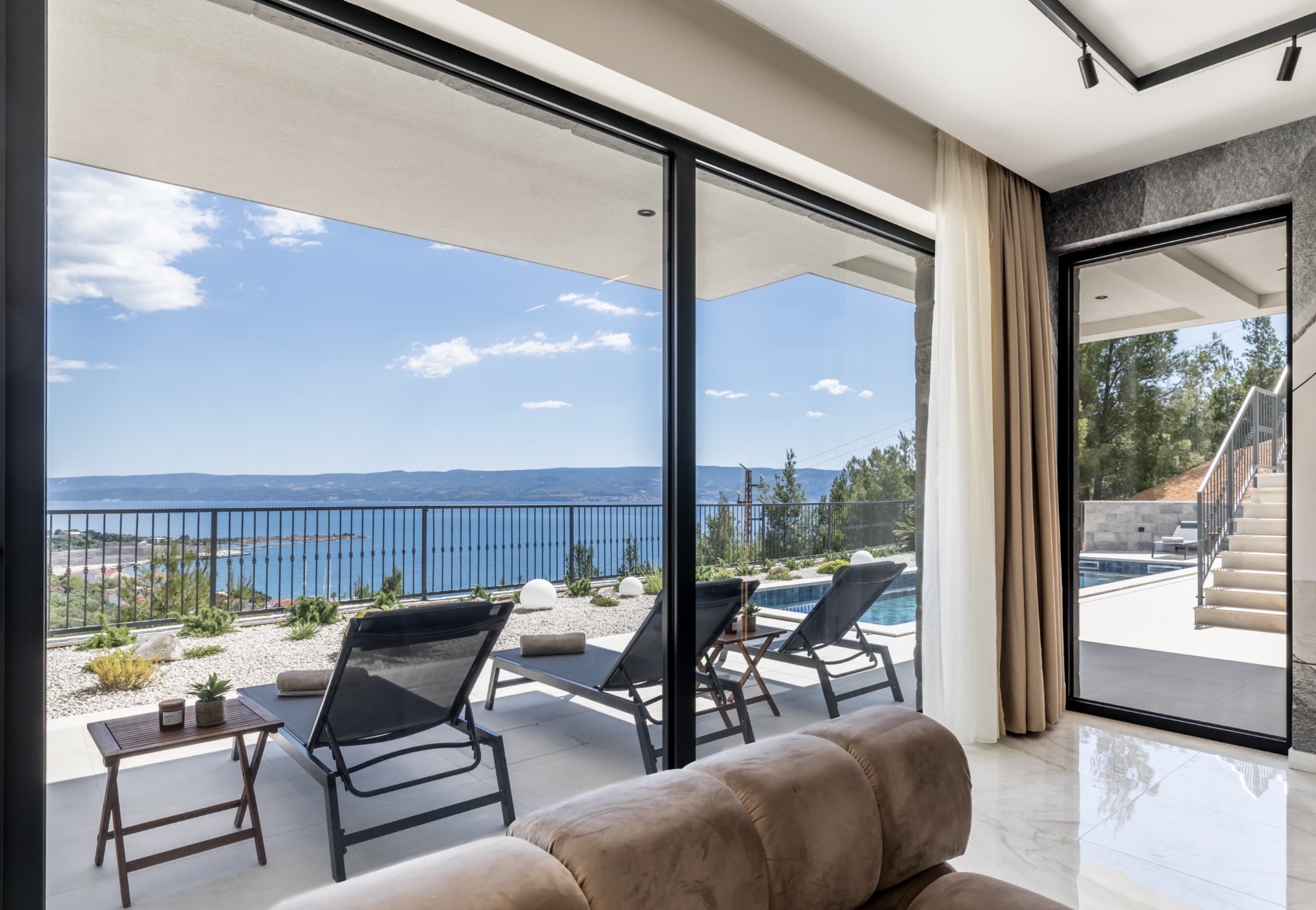 Sea-view terrace with sun loungers